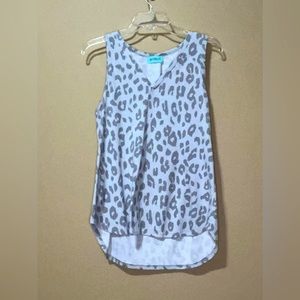 V-neck sleeveless top with high low hem